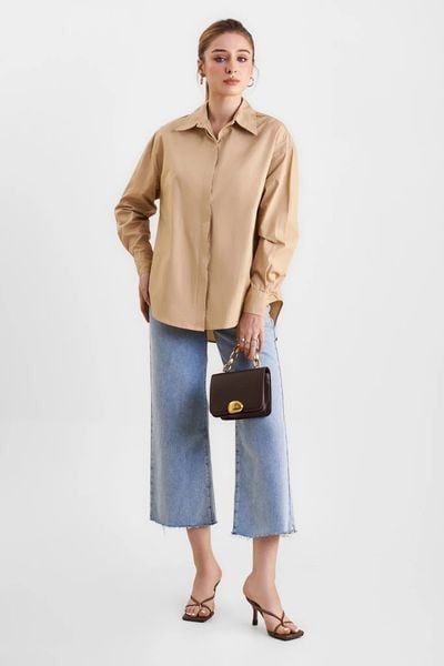 Thiết kế trang phục màu nâu đất sang trọng cho người tuổi 1985 mệnh Kim.