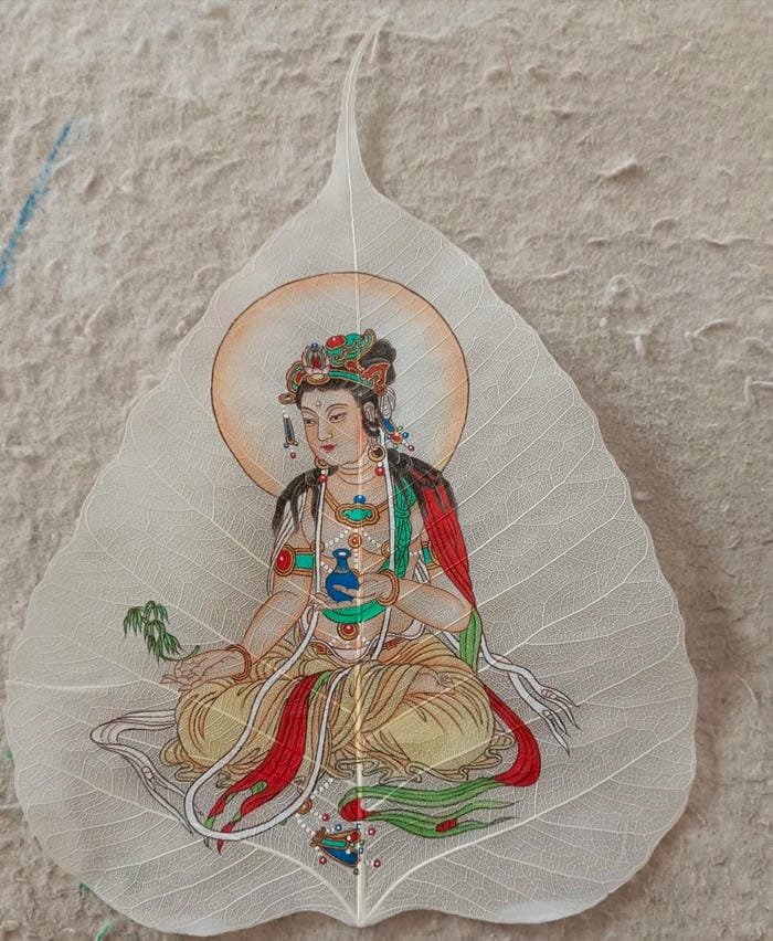 ảnh lá bồ đề khắc hình Phật