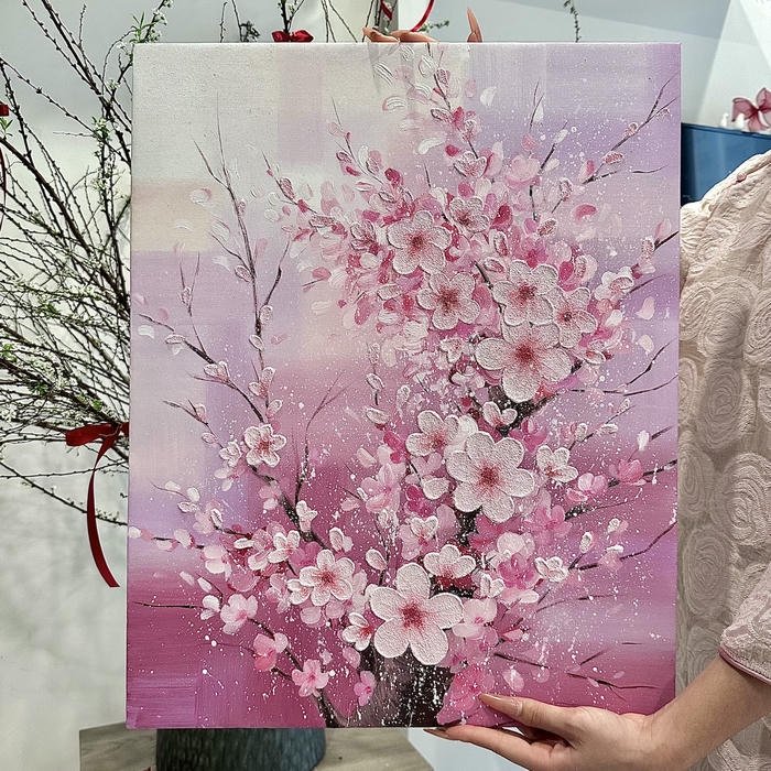 Tranh phong cảnh hoa đào cầm tay nền hồng nhạt
