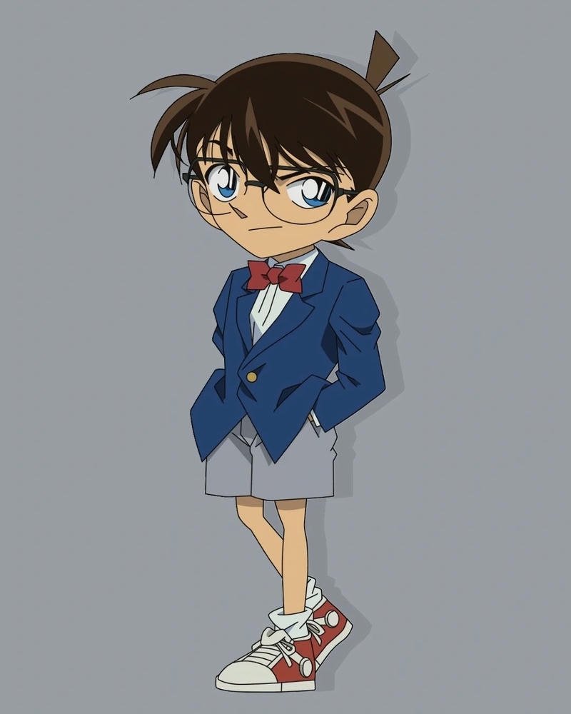 Ảnh Conan đứng nghiêm trang trong bộ vest xanh quần soóc đặc trưng