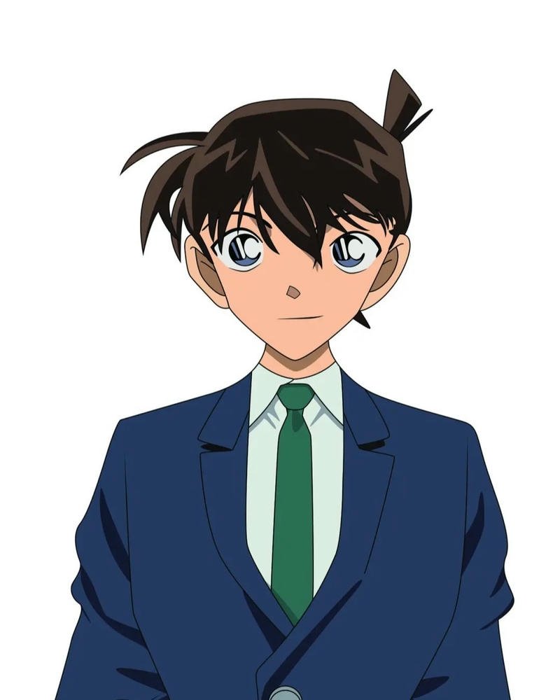 Ảnh Conan khi lớn mặc vest xanh thắt cà vạt chỉn chu nghiêm túc