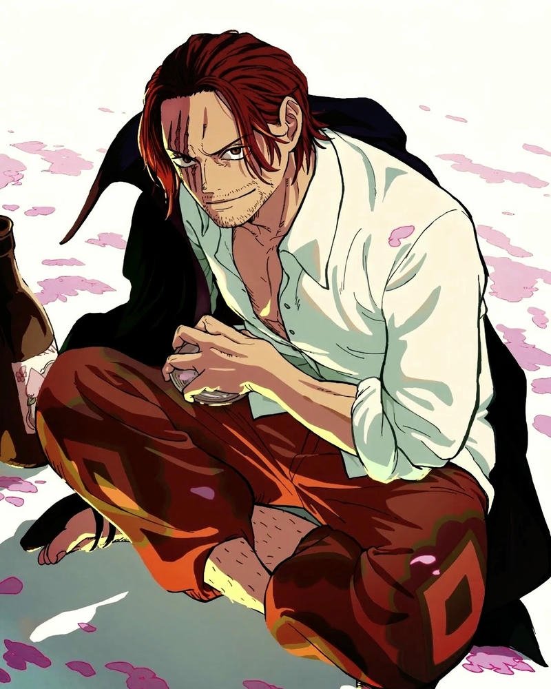 Ảnh Shanks ngồi bệt xuống đất nhìn xa xăm