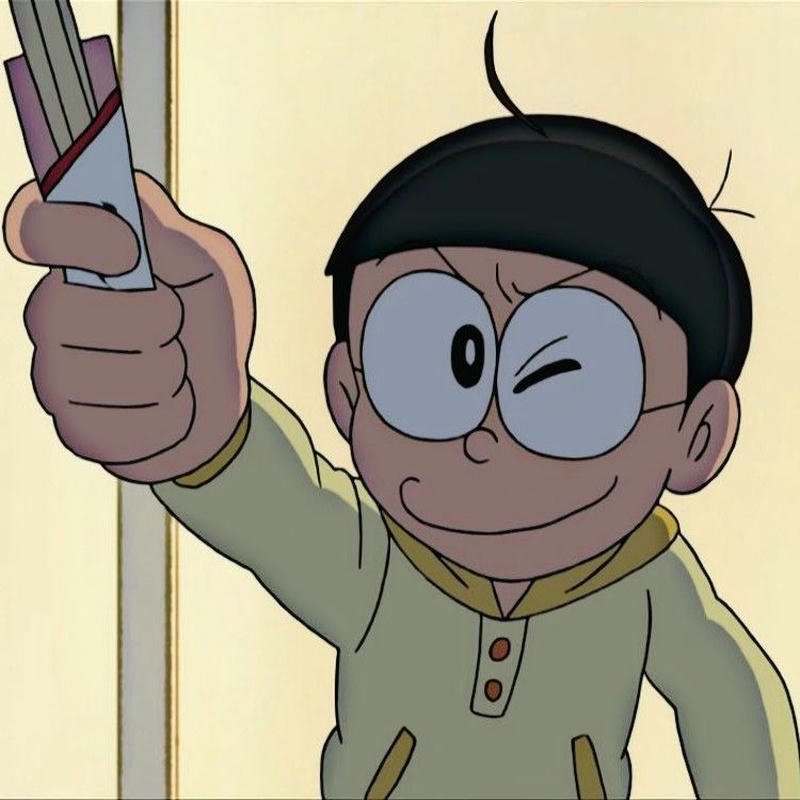 Nobita cầm bài kiểm tra điểm kém khóc ròng rĩ