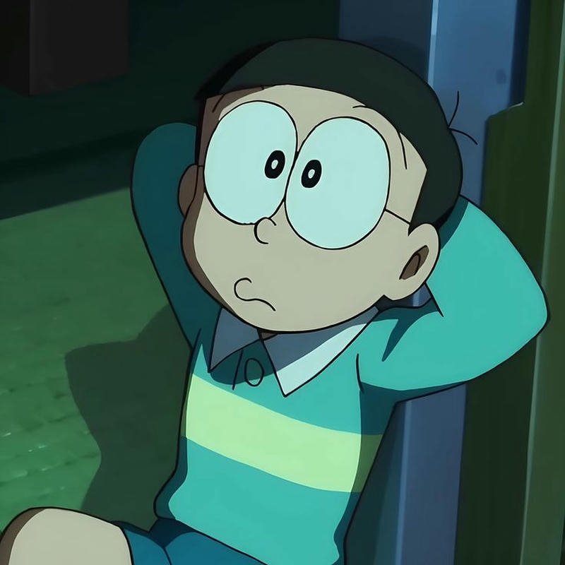 Nobita lười biếng nằm thư giãn gác chân lên gối