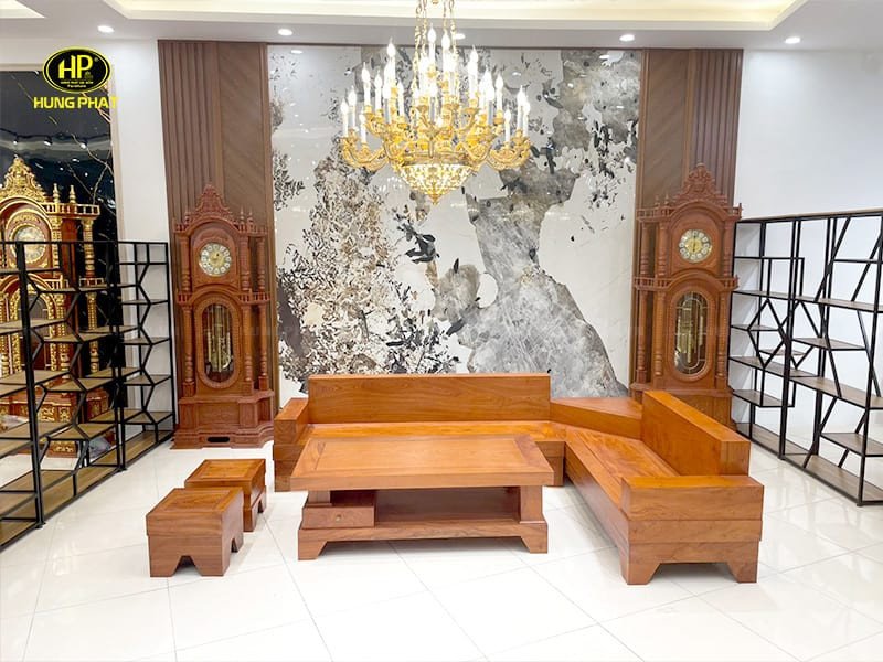 Bộ sofa gỗ nguyên khối chữ L làm từ gỗ hương đá đặt trong không gian phòng khách
