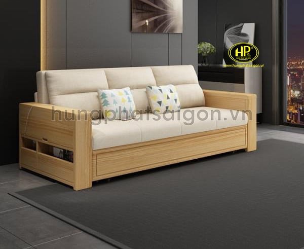 Sofa giường màu xám được kéo rộng thành giường ngủ, thể hiện tính năng đa năng và tiết kiệm diện tích cho căn hộ